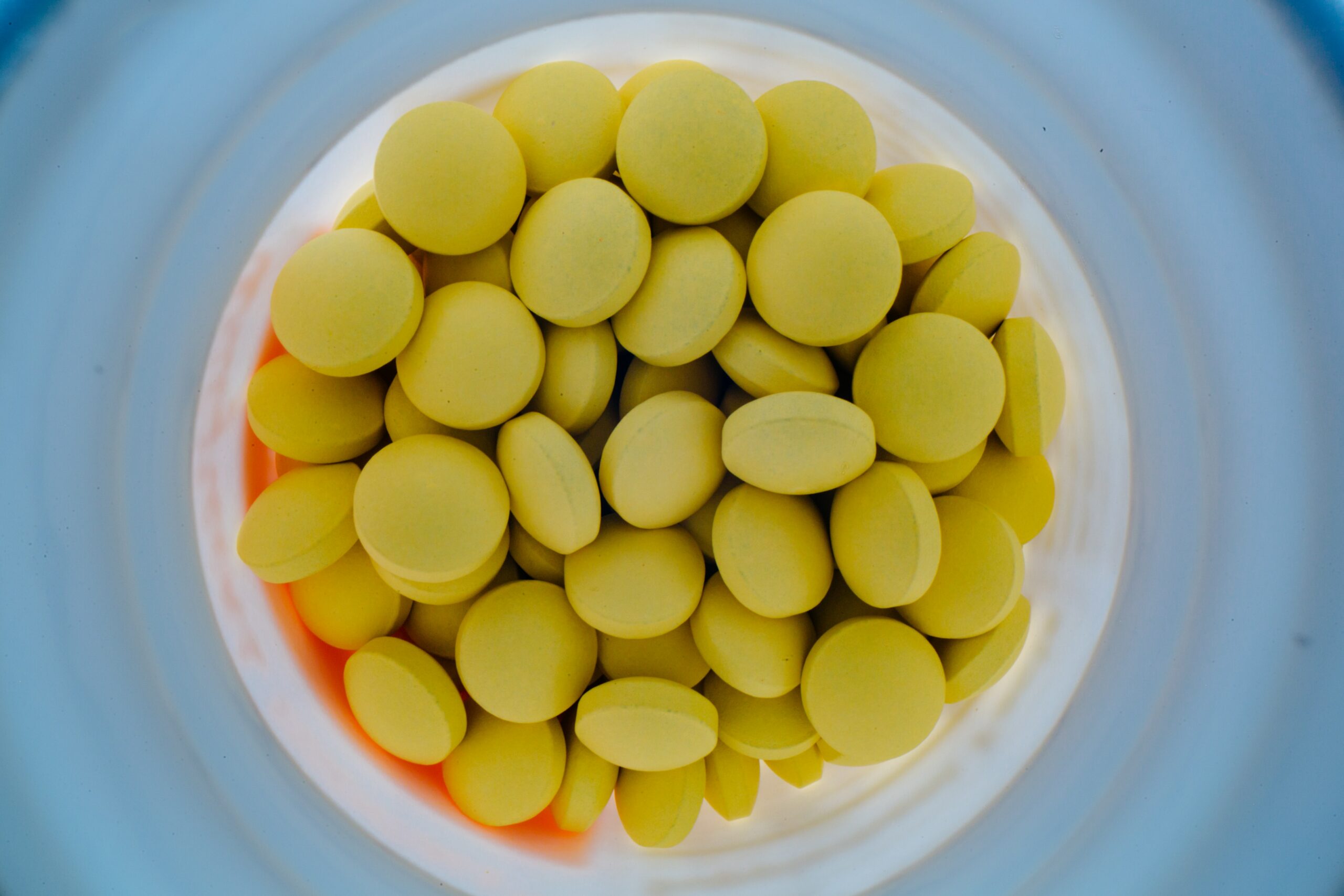 Pregnant woman taking folic acid pills